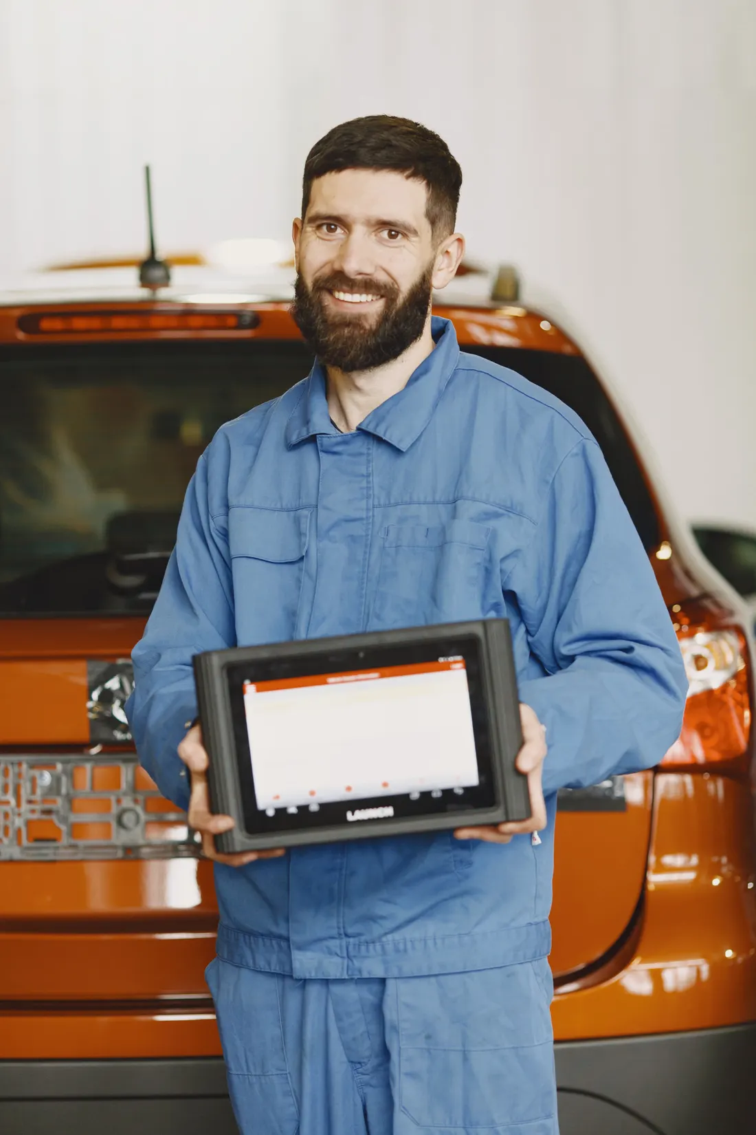 Mobile diagnostics — technician using an automotive diagnostic scan tool